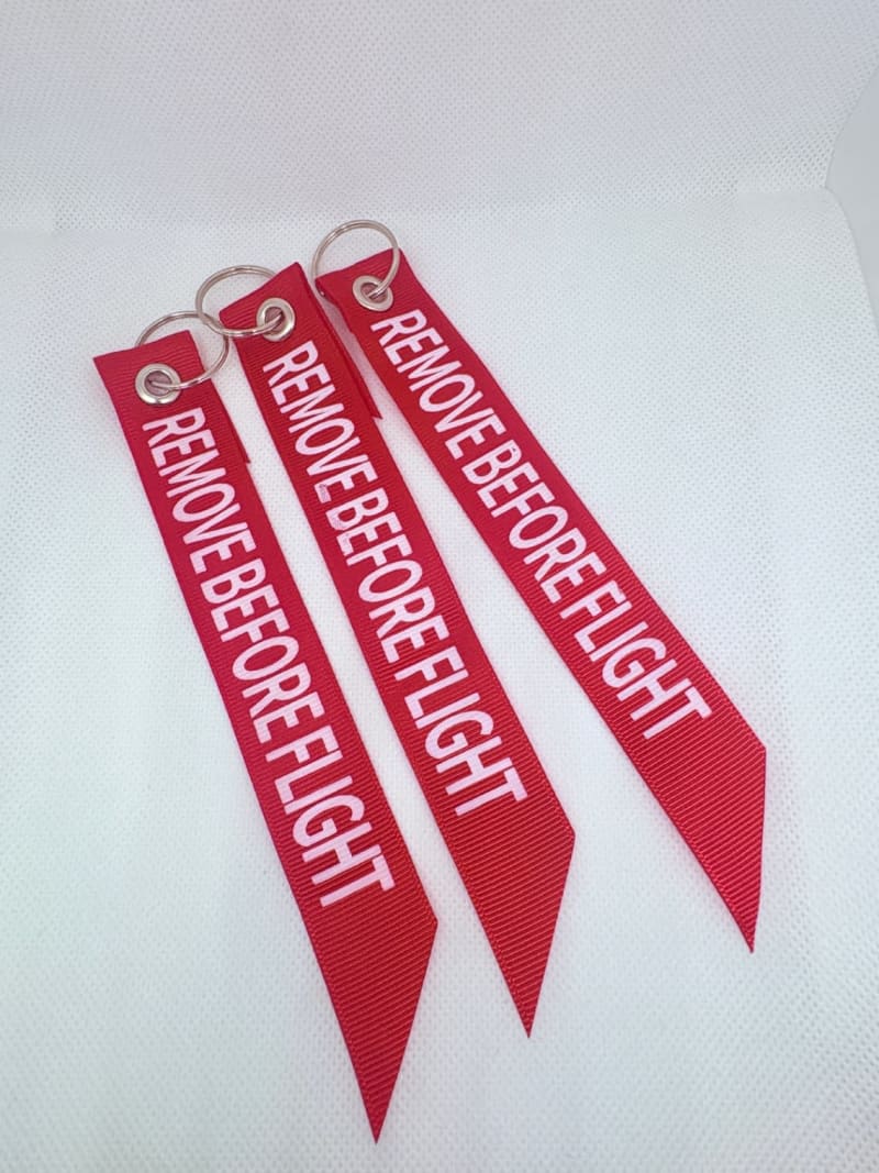 Llavero tipo listón “Remove Before Flight” ✈️💙 1