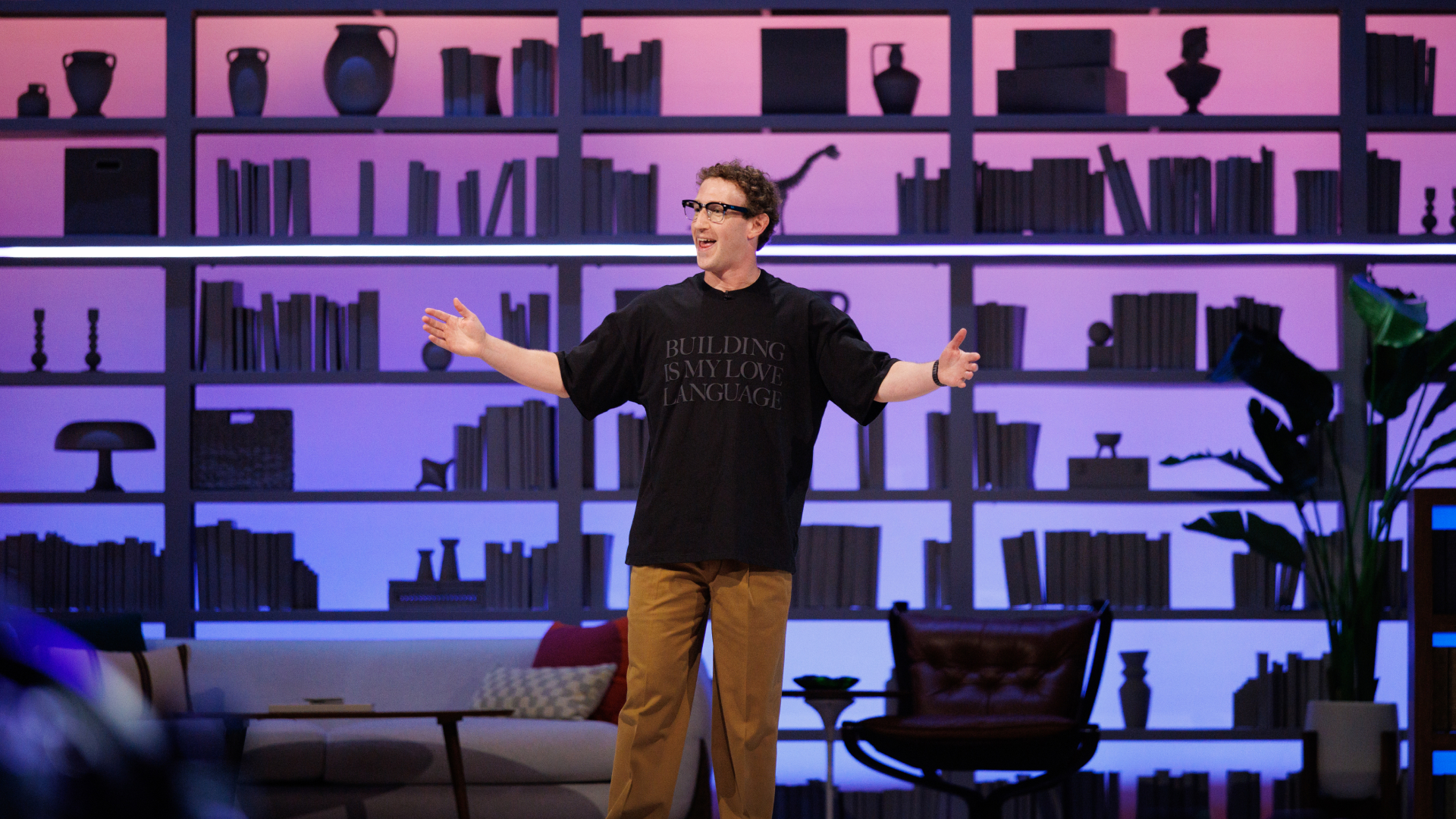 Mark Zuckerberg on stage at Meta Connect 2026 with arms open in front of a lit bookshelf set