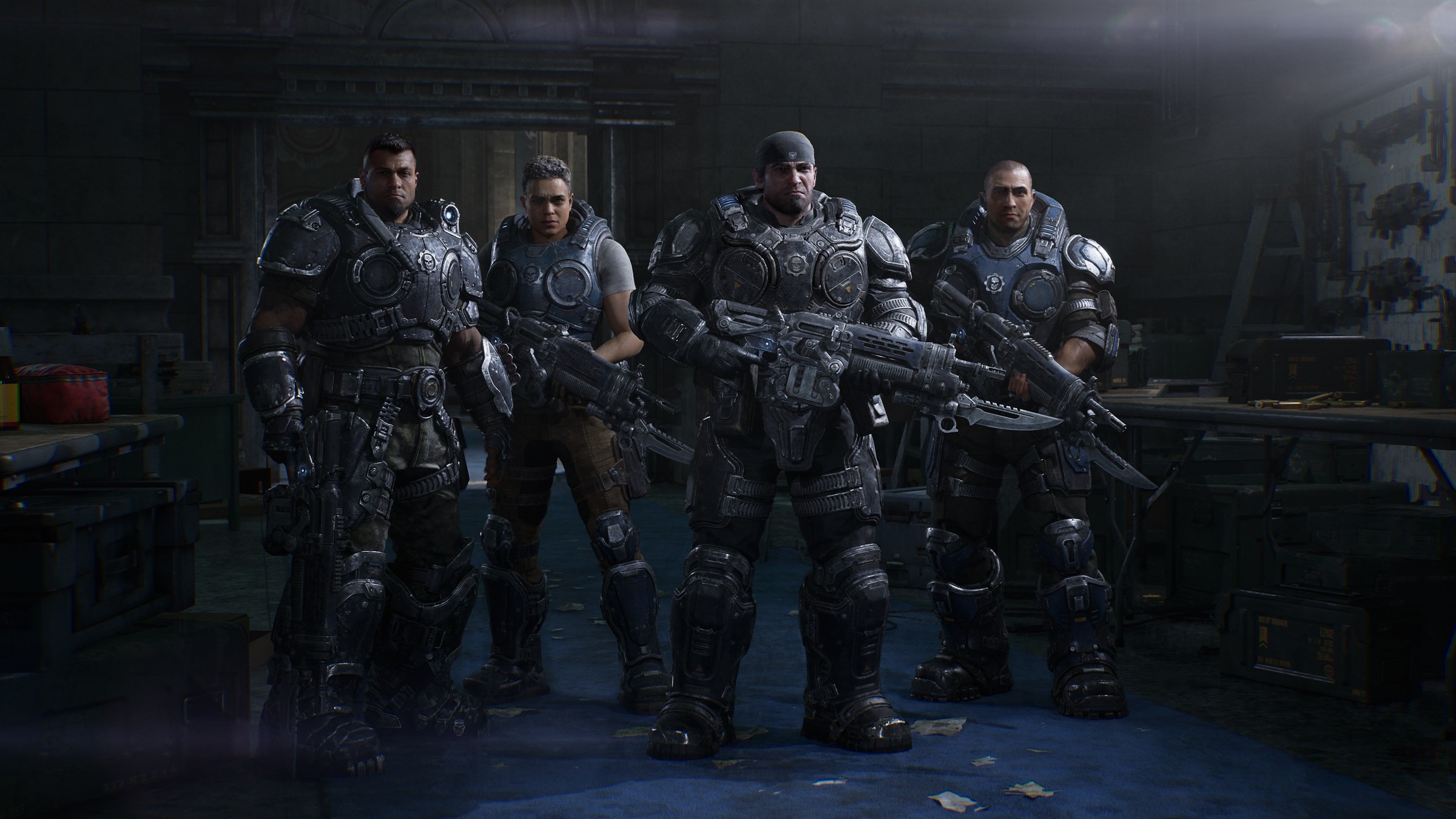 Official Gears of War: E-Day screenshot of four armoured soldiers with rifles standing side by side in a dim armoury