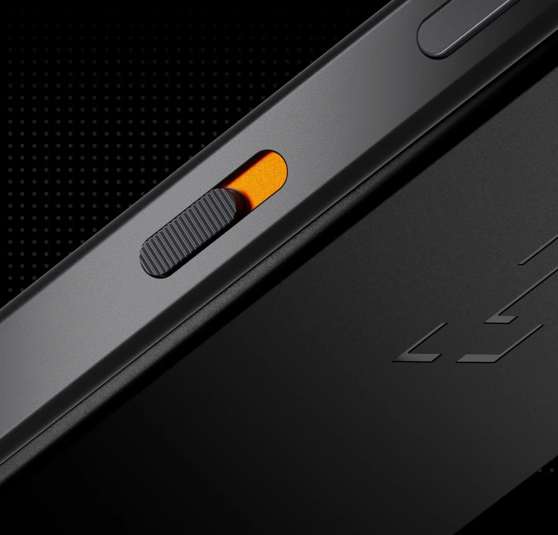 Close-up of the Ledger Atom side rail showing the orange-accented physical privacy switch