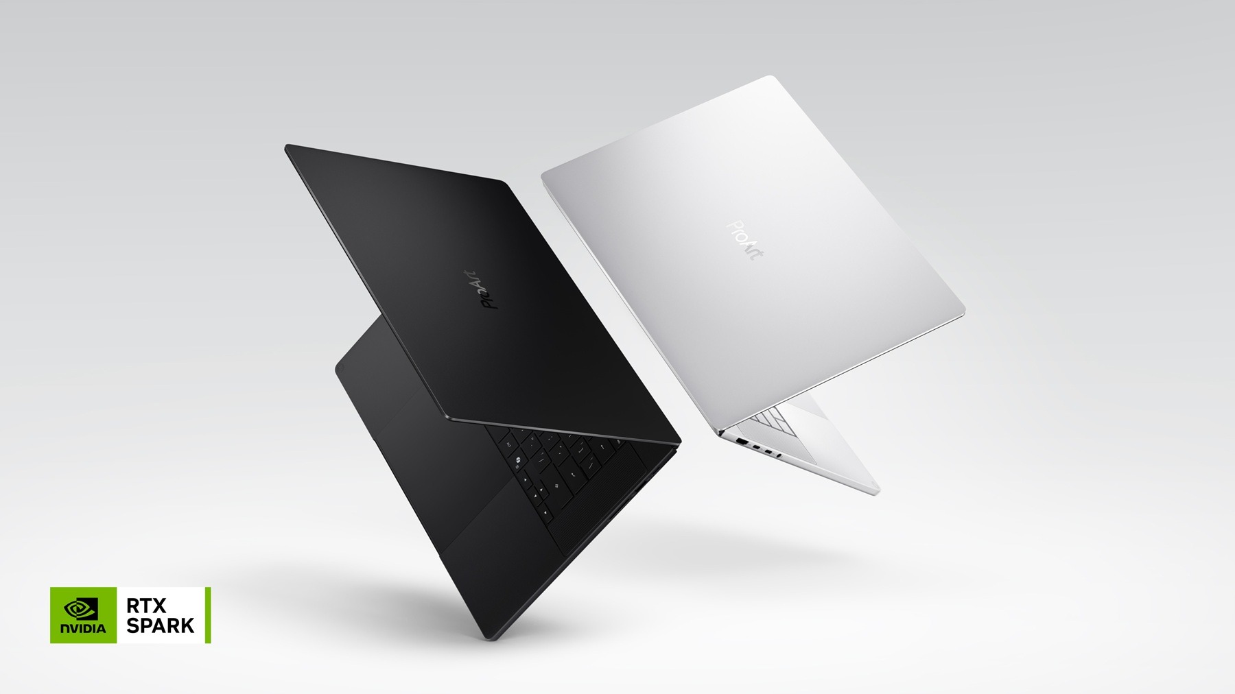 ASUS ProArt RTX Spark laptops in Nano Black and Neo White floating at an angle on a light grey background, with an NVIDIA RTX Spark badge in the corner