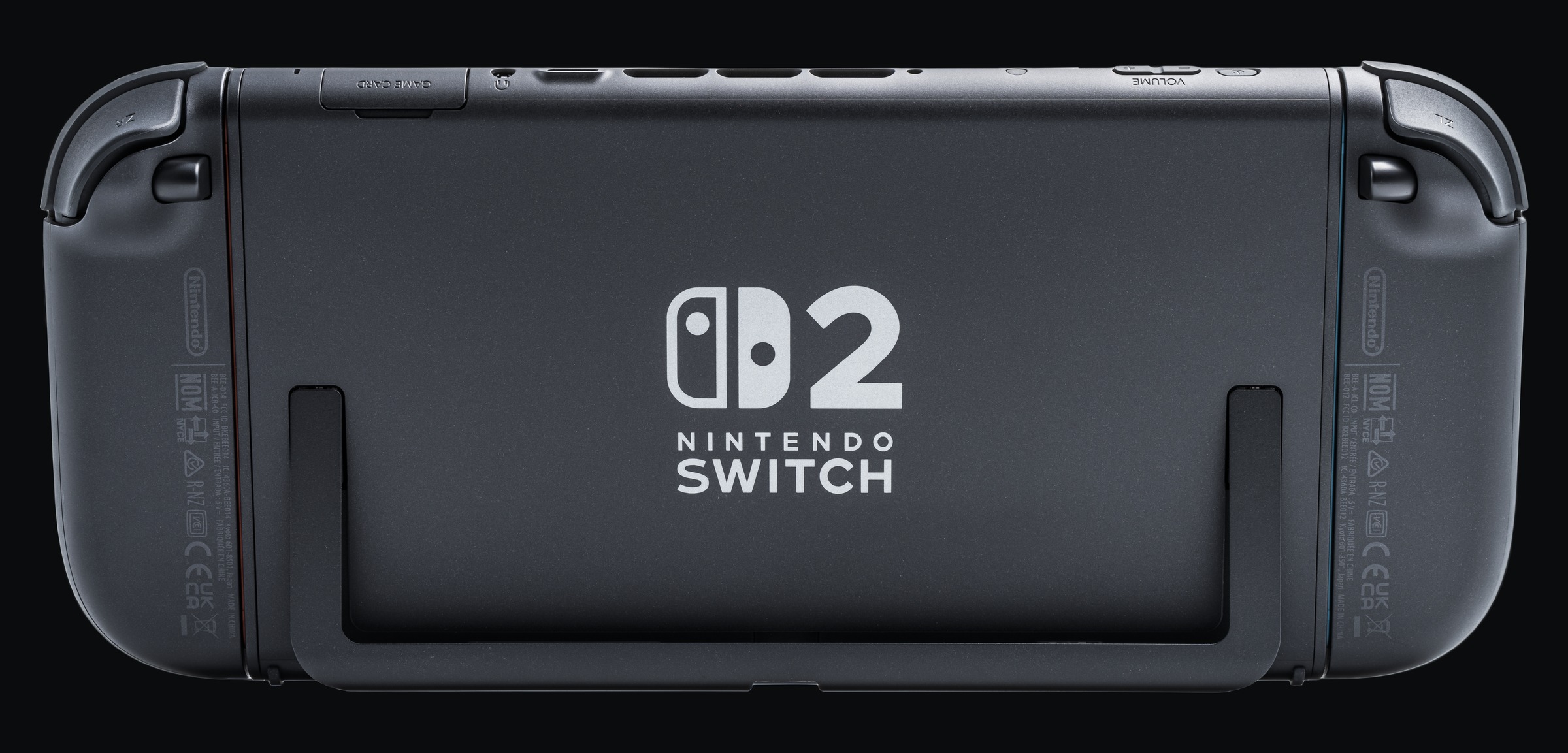 Back of a black Nintendo Switch 2 console with Joy-Con 2 controllers attached, shown on a dark background