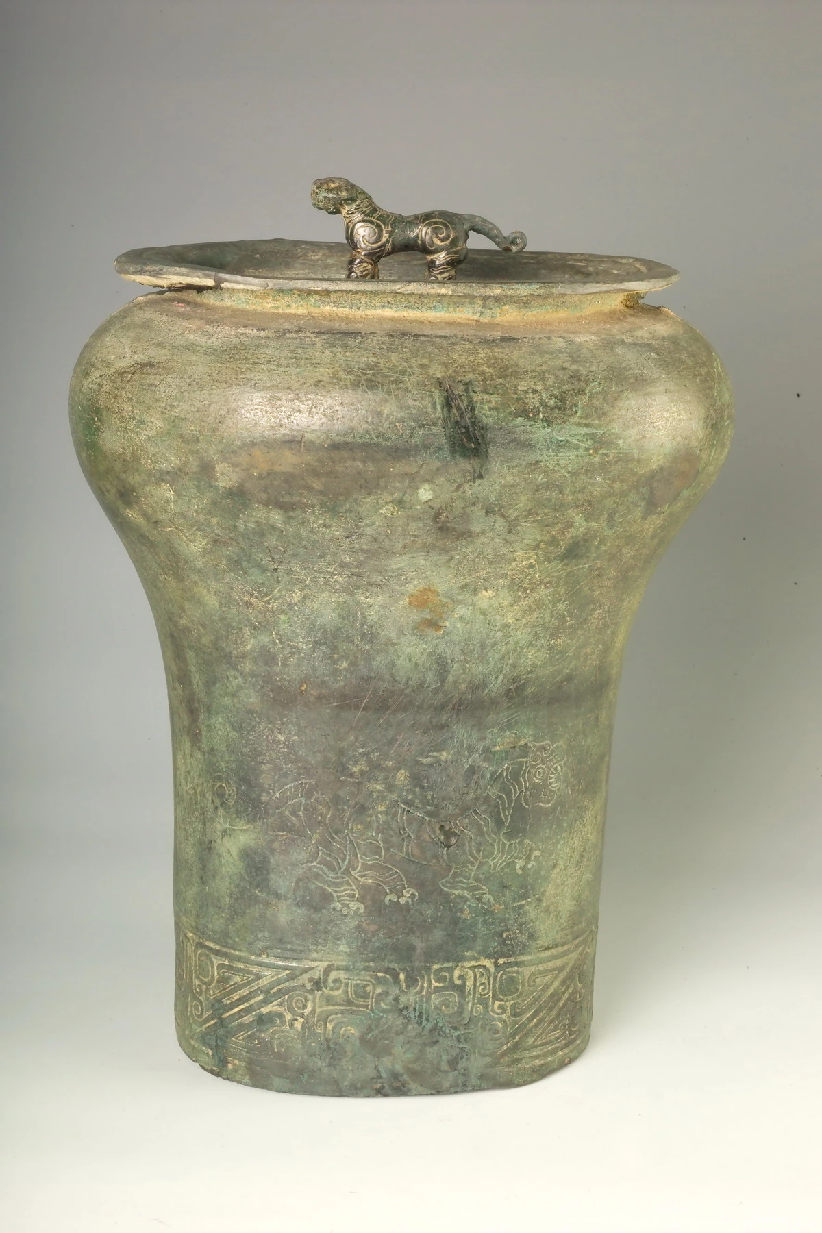 Bronze vessel with a tiger-shaped handle