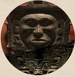 Bronze ding with a human face