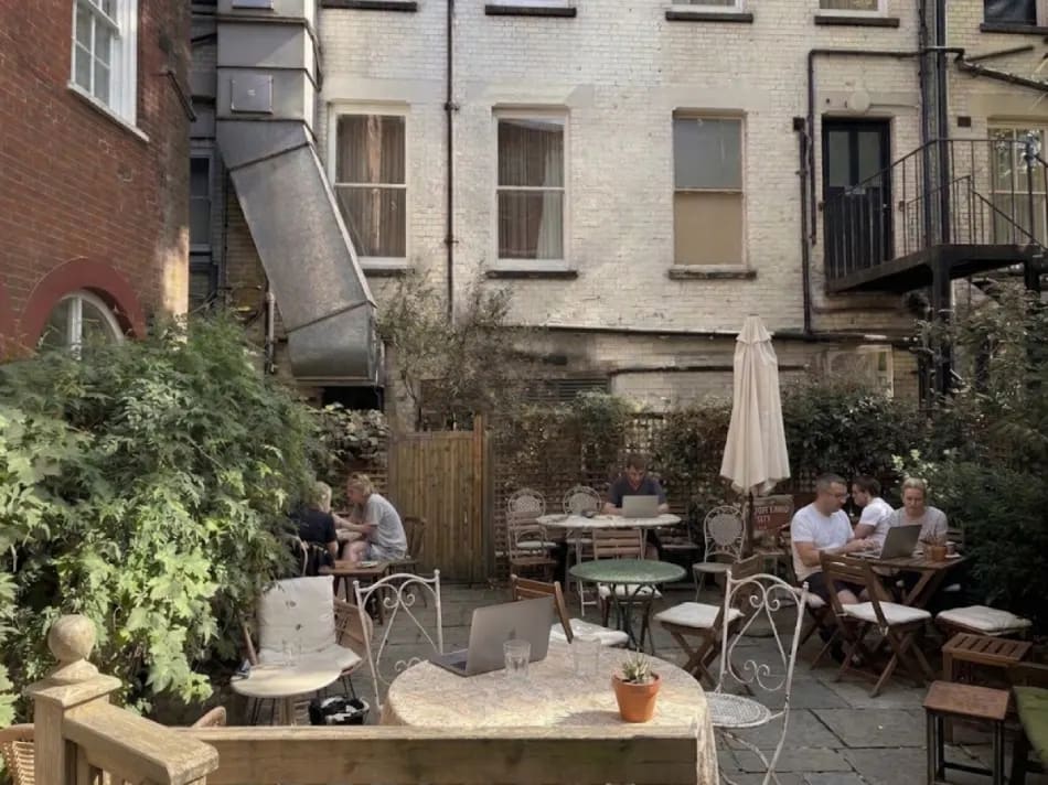 Sacred Grounds hidden garden seating, Dean Street Soho