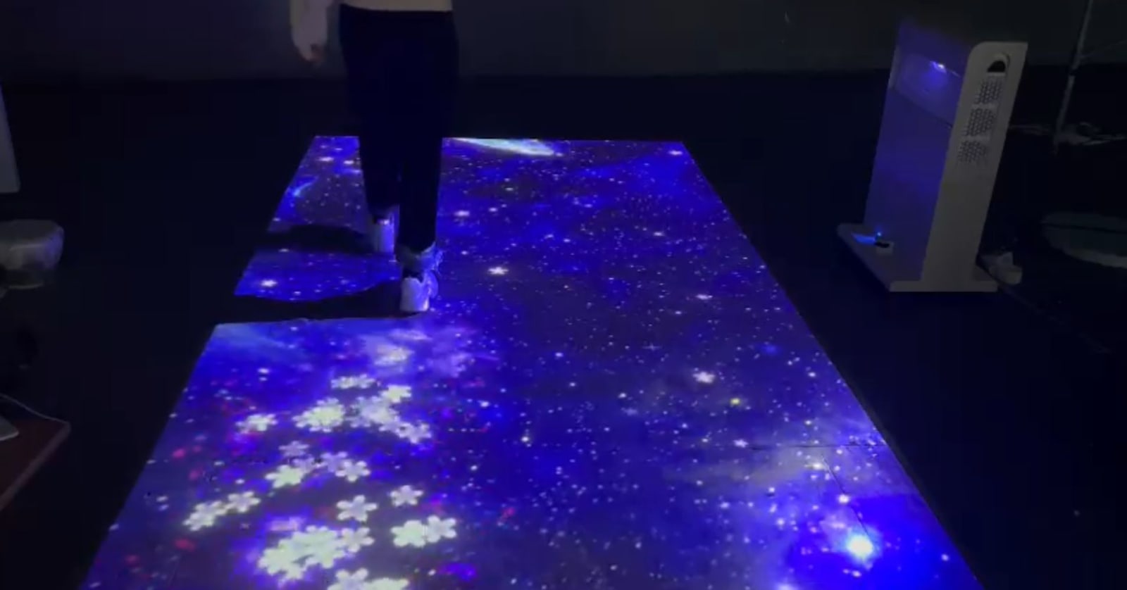 Infinity Mobile Laser Interactive Floor Projector Tower — real use, person playing interactive floor game