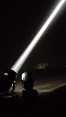 7000W sky beam searchlight cutting into the night sky — Infinity Projectors outdoor searchlight