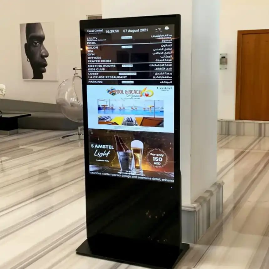Interactive Floorstanding Touchscreen Kiosks — Real estate logo gobo projection for property branding — cast in light by a custom gobo projector