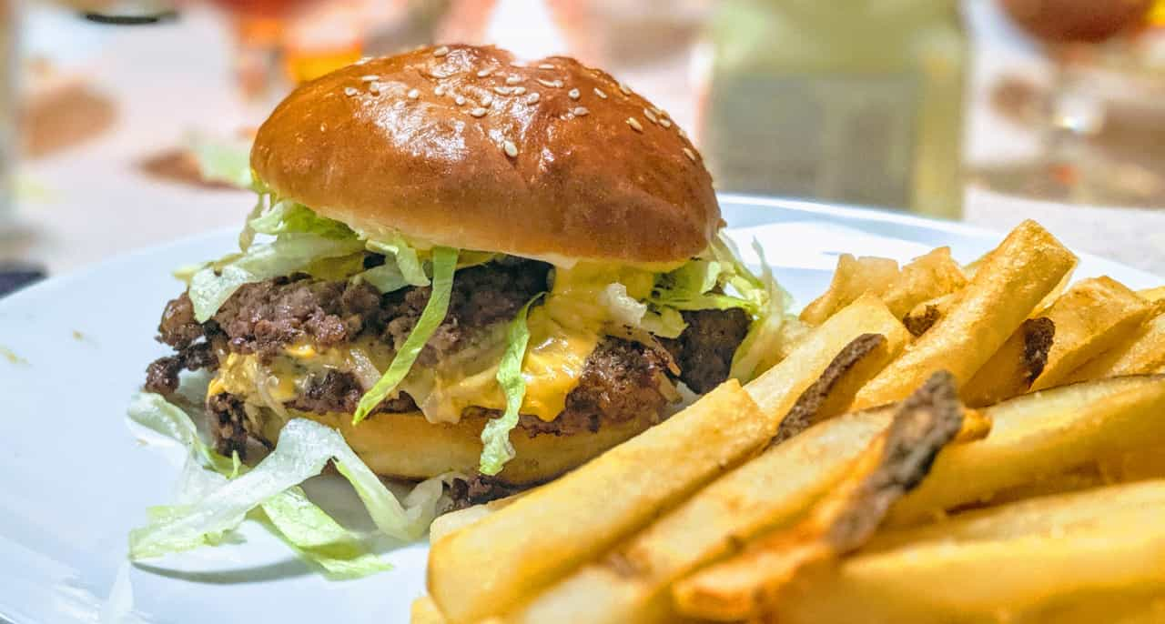 A smashburger with fries.