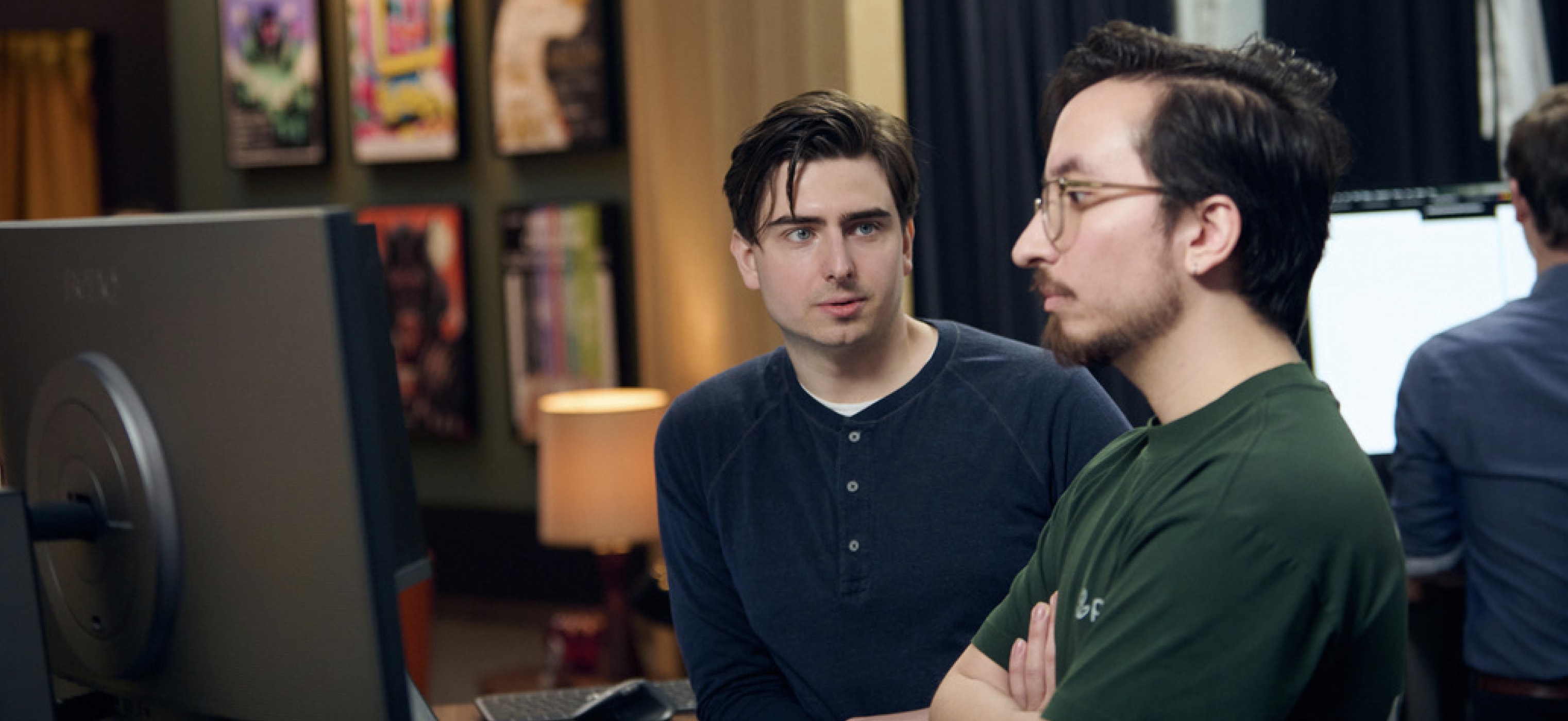 Chris and Christian looking at a screen together on the set of Web Dev Challenge