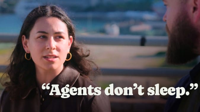 Rita Kozlov in mid-conversation with Jason Lengstorf, who is barely visible on the right side of the frame. The waterfront in Miami is visible in the background out of focus. The text "Agents don't sleep" is overlaid.
