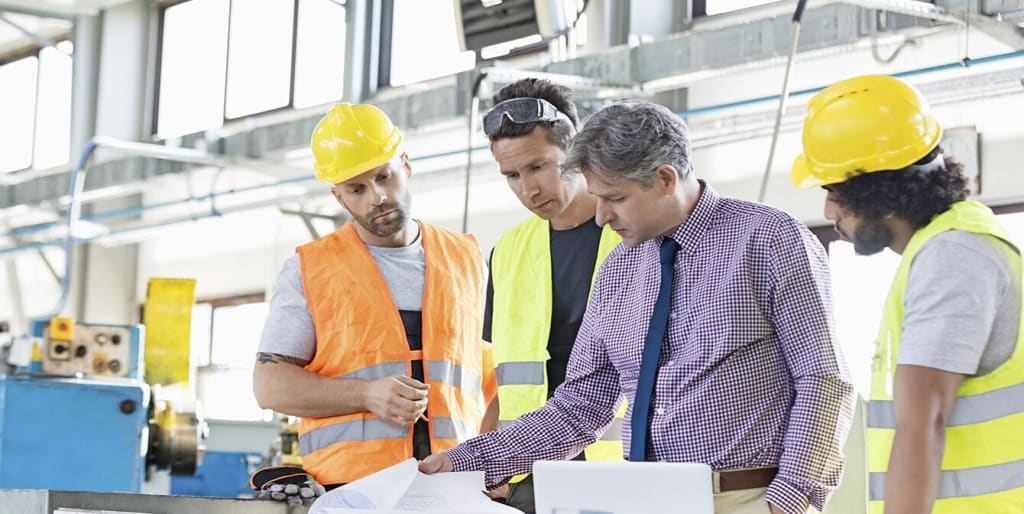 Facilities manager reviews plans with team