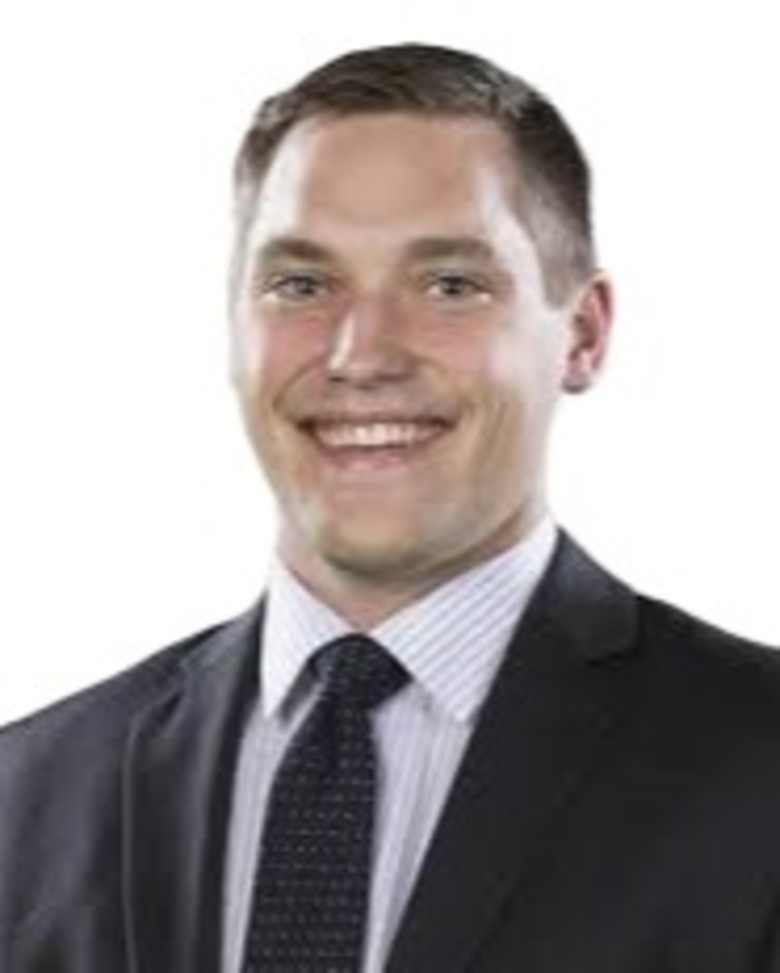 Portrait of Jake Wisness, Managing Director, Capital Markets at JLL in Seattle