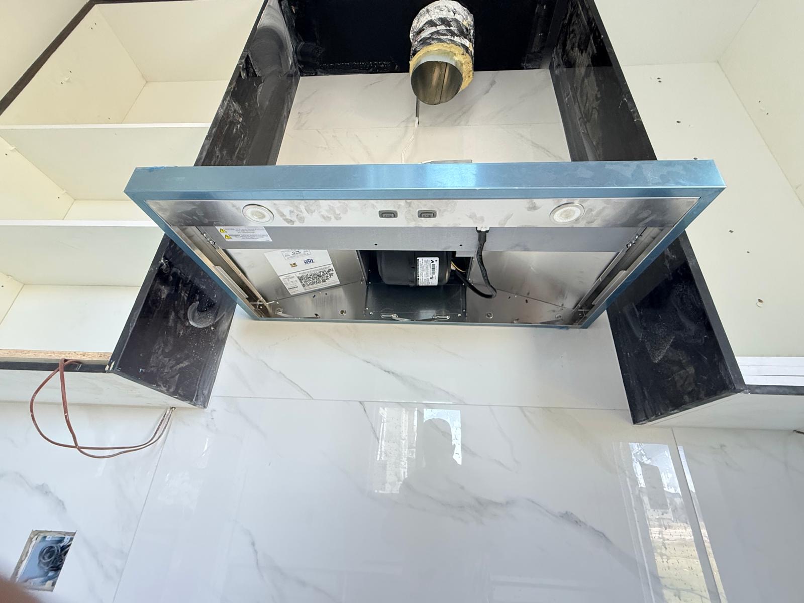 Finished kitchen range hood electrical installation
