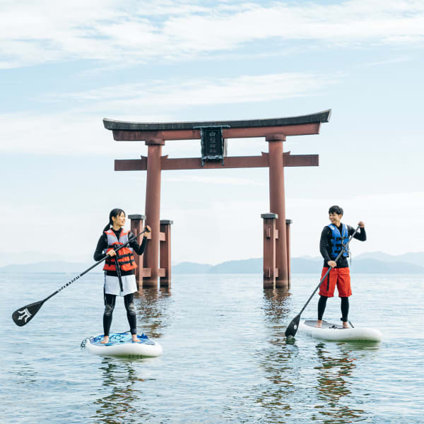 Paddle up to the giant red gates of Shirahige Jinja