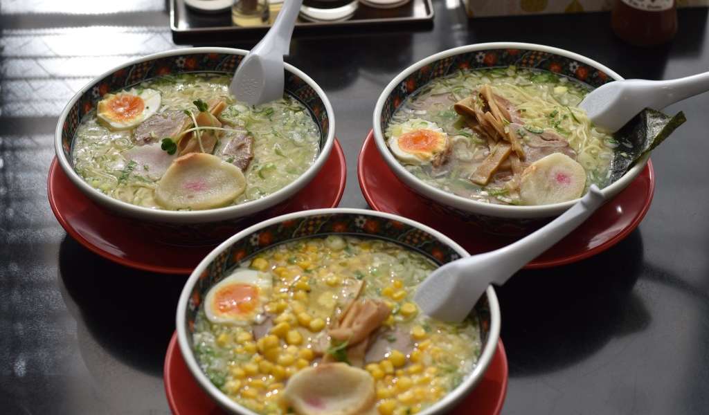 Miso, salt and Sapporo ramen in bowls on a table