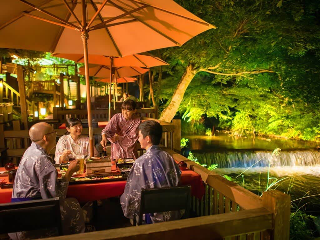 Waterside dining in summer at Harataki Higashiyama Onsen in Fukushima Prefecture