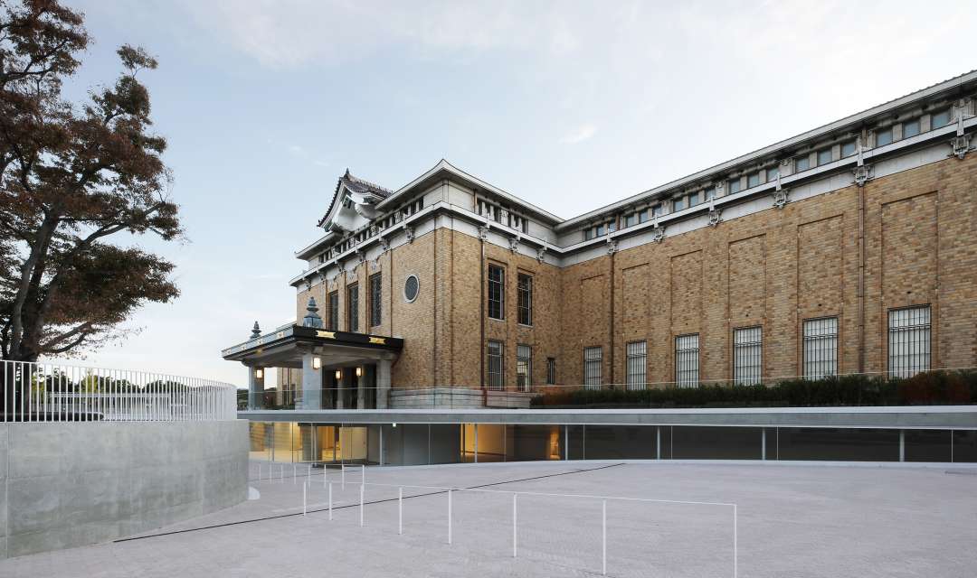 the facade of a large brick building shot from an angle