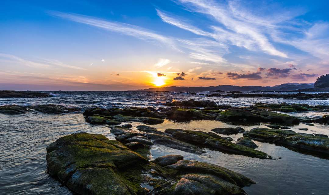 Rocky shoreline along Shimoda beach near Tokyo for a beach break