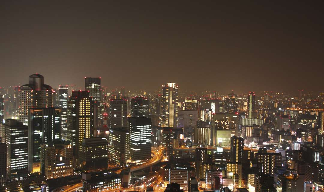 a city of lit skyscrapers at night