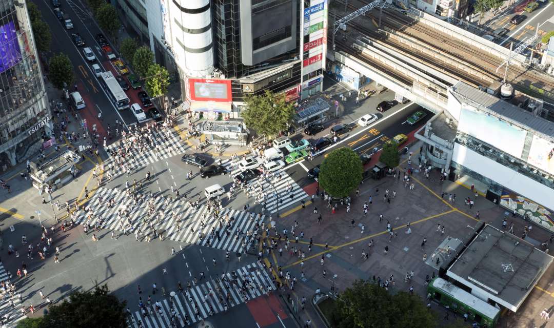 a shot of a busy pedestrian crossing shot from above