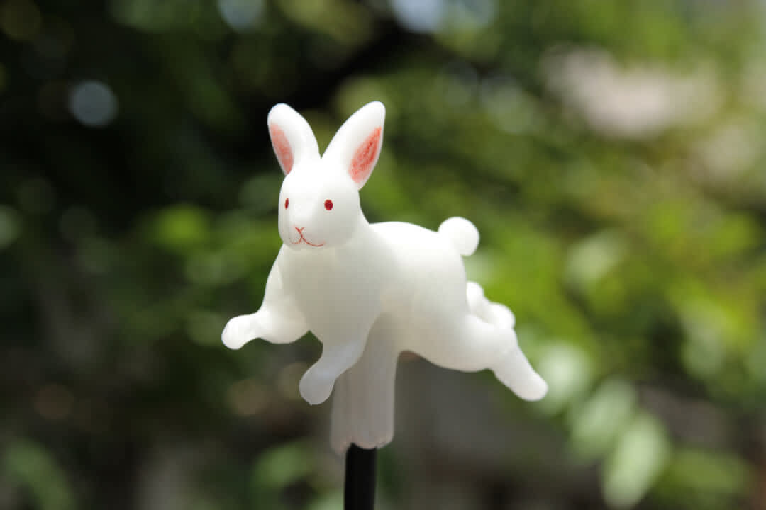 A rabbit-shaped candy on a stick created using the centuries-old craft of amezaiku