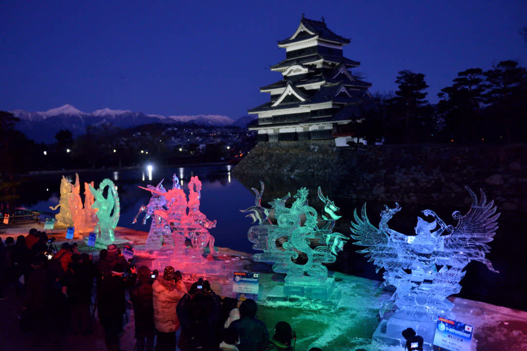 Ice sculptures lit up with colourful lights in front of Matsumoto Castle in Nagano Prefecture