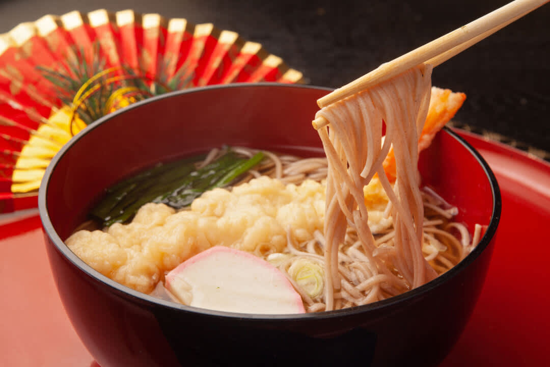 Bowl of toshikoshi soba, buckwheat noodles eaten at new year in Japan