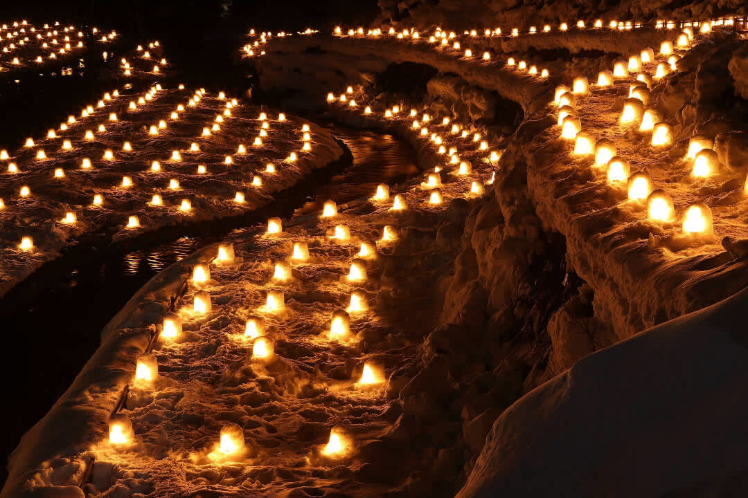 Mini kamakura, snow huts similar to igloos, are lit up with candles at Yunishigawa Onsen, Tochigi Prefecture