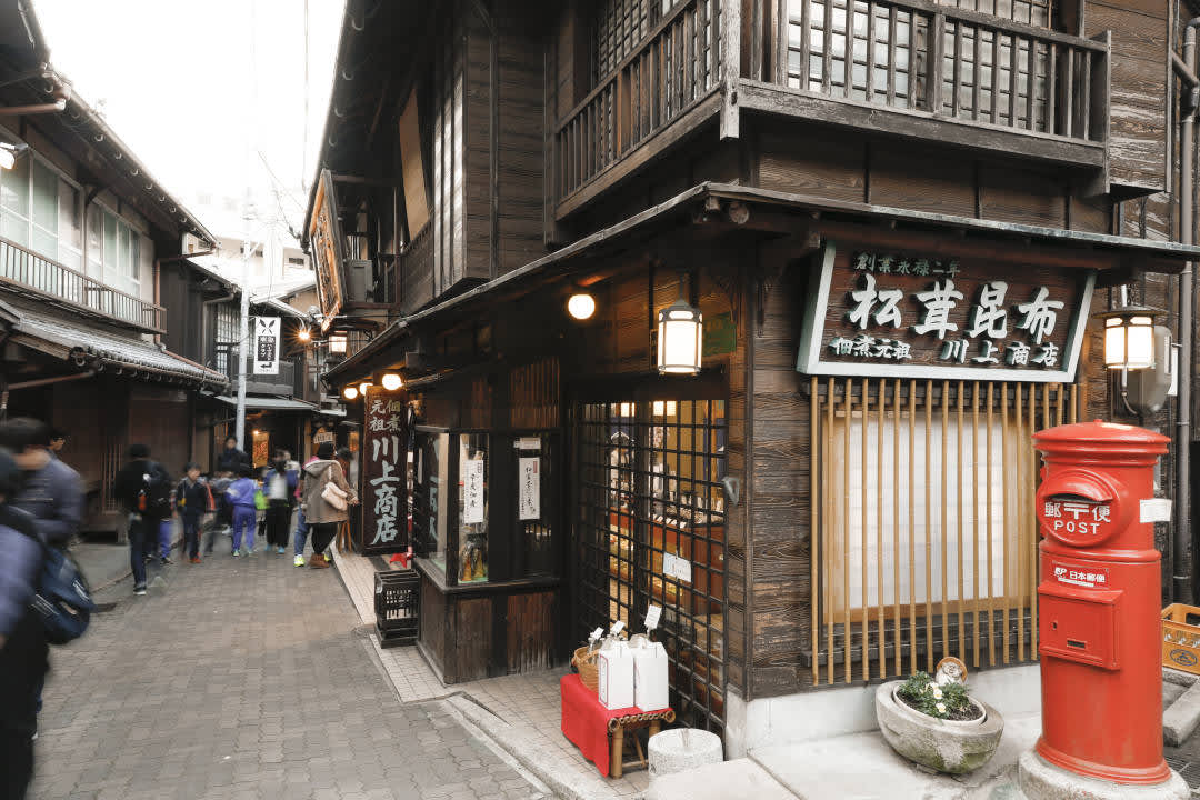 People walking along a street in the traditional hot spring town of Arima Onsen in Kobe City, Hyogo Prefecture