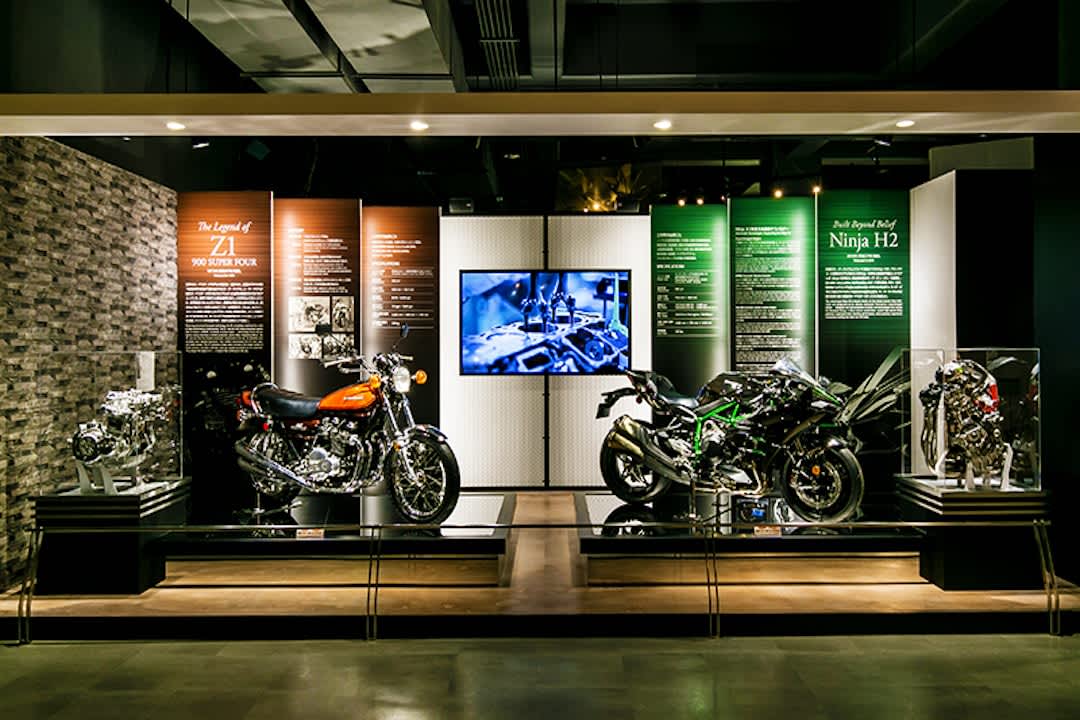 Display of two Kawasaki motorbikes at Kawasaki Good Times World in Hyogo Prefecture.