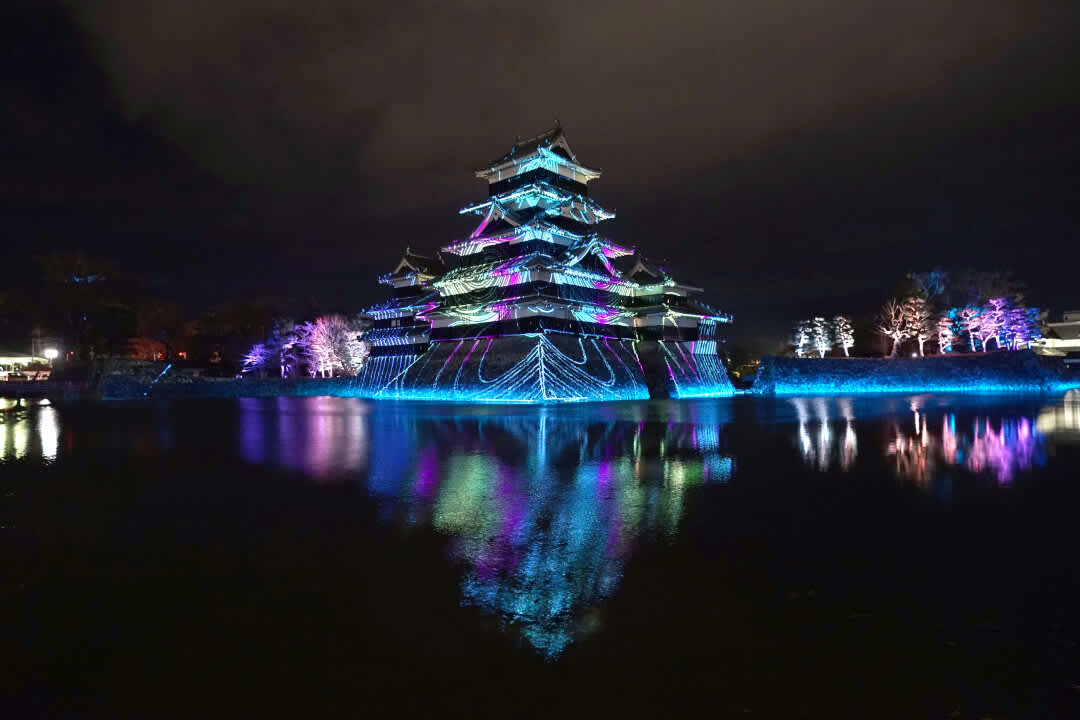 Matsumoto Castle, Nagano Prefecture lit up with a colourful projection mapping display