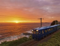 Passengers catch a brief glimpse of Doll Rock, as the train passes between tunnels. (left) Passengers can enjoy spectacular views from the train as it hugs the coastline between Satsuma-Taki Station and Nishikata Station. (right)