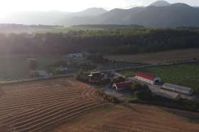 an aerial shot of ezura farm in hokkaido