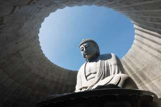 a sitting Buddha in Makomanai Takino Cemetery