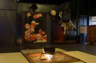 the traditional tatami floor and a Japanese style open hearth
