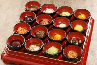 colourful meal includes mochi served in zoni (soup with red bean), zunda (mashed beans), and june (freshwater shrimp)