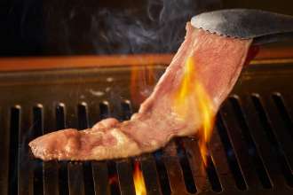 grilled wagyu beef at your table over a charcoal or gas brazier