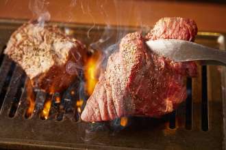 grilled wagyu beef at your table over a charcoal or gas brazier