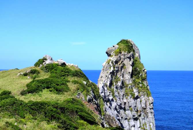 rock formation standing tall off the coast in Nagasaki