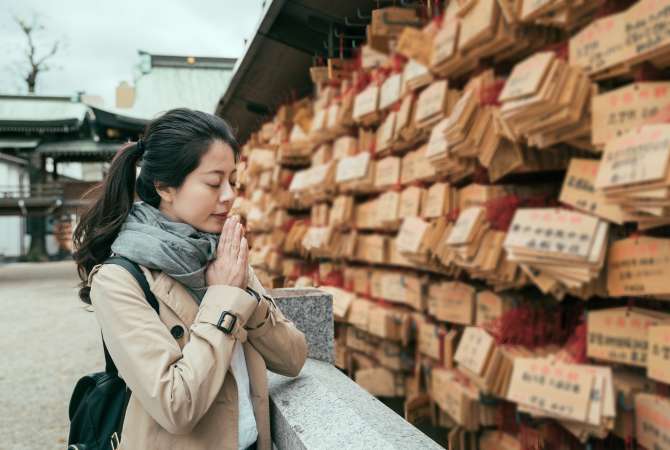 lots of people choose to write down their wishes on an ema wooden plaque.