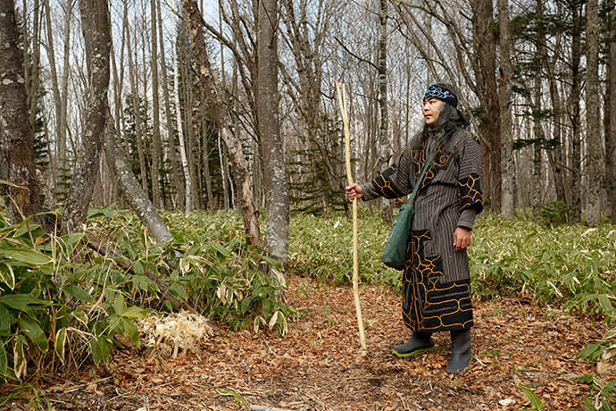 Ainu guide Kengo Takiguchi at the entrance to the forest.