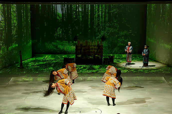 During the traditional dance, performers swing their long black hair to evoke pine trees swaying in a storm.