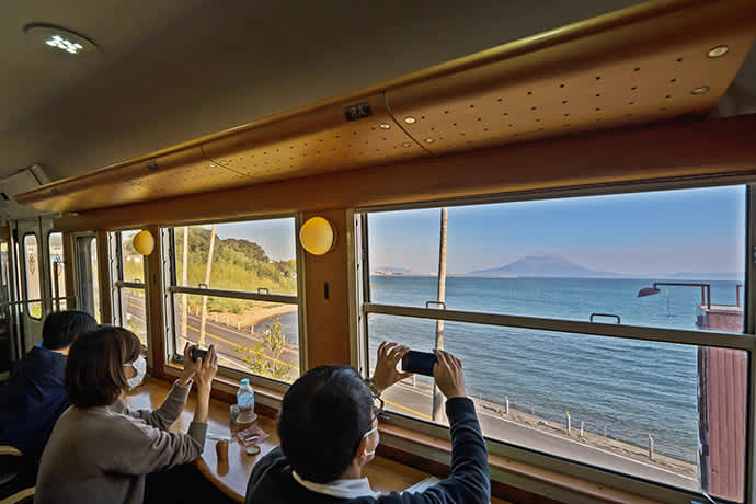 The island of Sakurajima with its impressive volcano, is clearly visible from the train. The volcanic island is 15 minutes by ferry from Kagoshima’s port area.