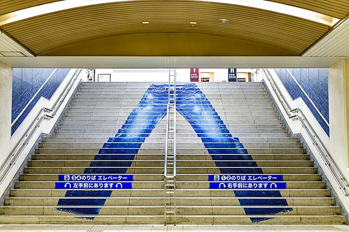 A large jeans design on stairs in Kojima Station