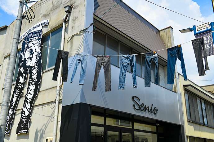 Pairs of jeans hung over Jeans Street