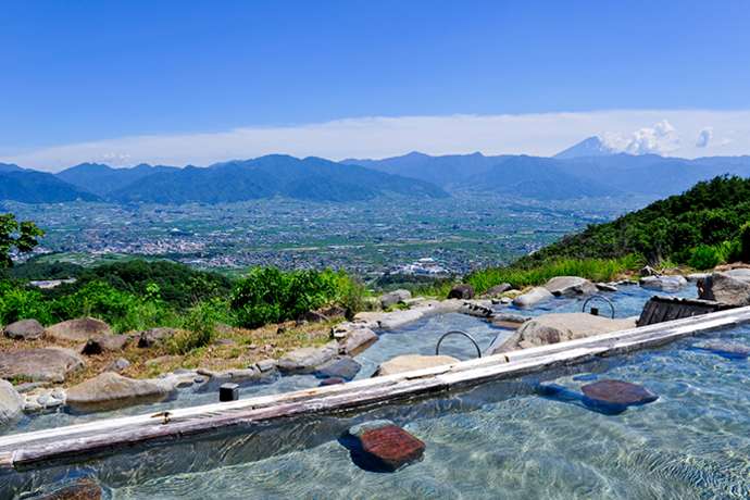 View of Mt. Fuji from the outdoor bath at Hottarakashi Onsen.