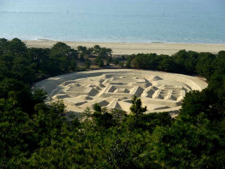 Kanei Tsuho (the old Japanese coin) sand art in the Ariake Beach in Kanonji City