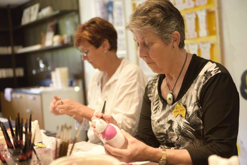 ladies painting their own manekineko