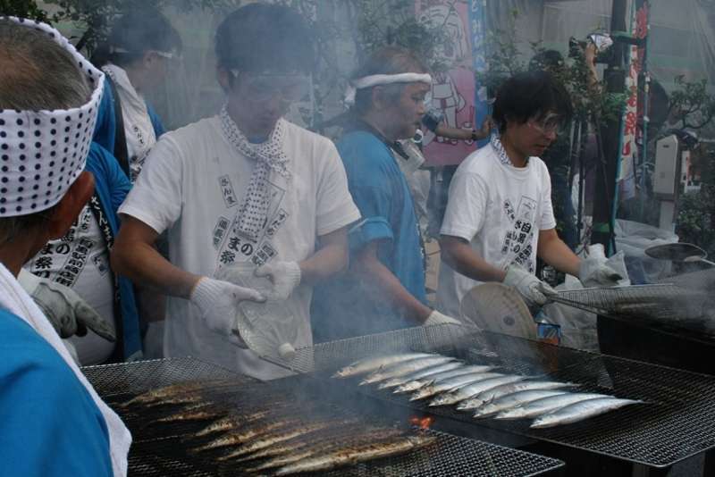 sauries are chargrilled during the Meguro Pacific Saury Festival